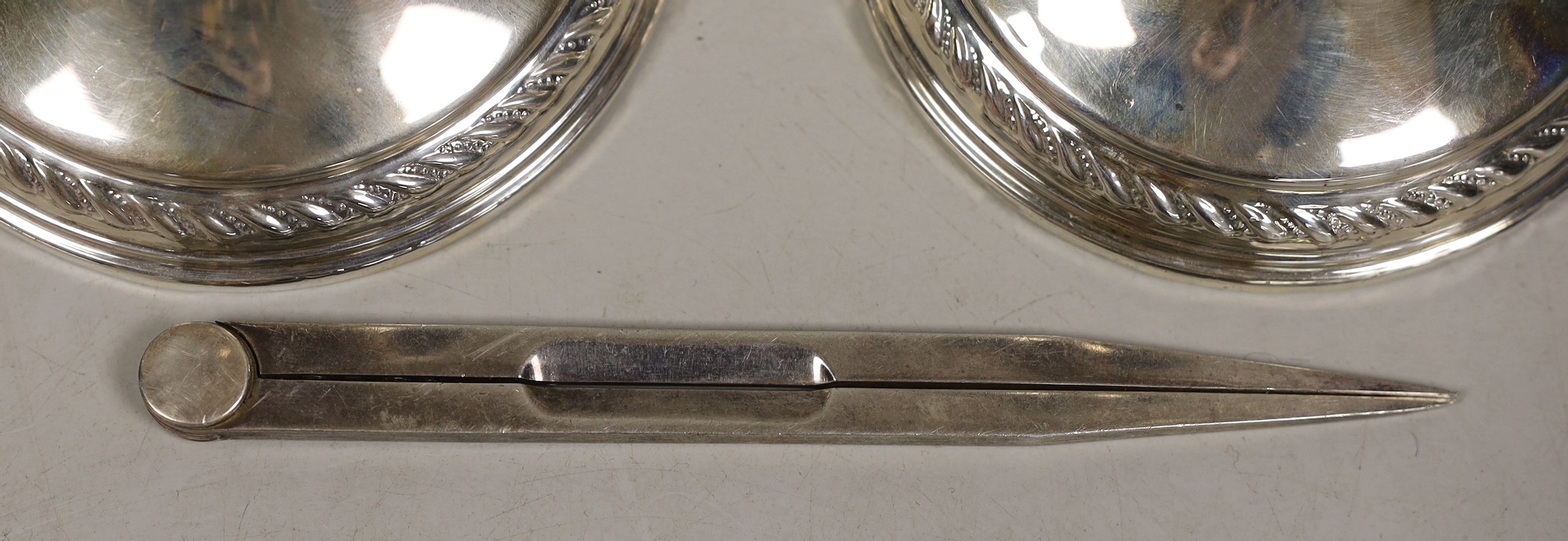 A pair of sterling mounted dwarf candlesticks, 11.9cm and a pair of modern silver compass dividers, maker, LP, London, 1990, 14.5cm.